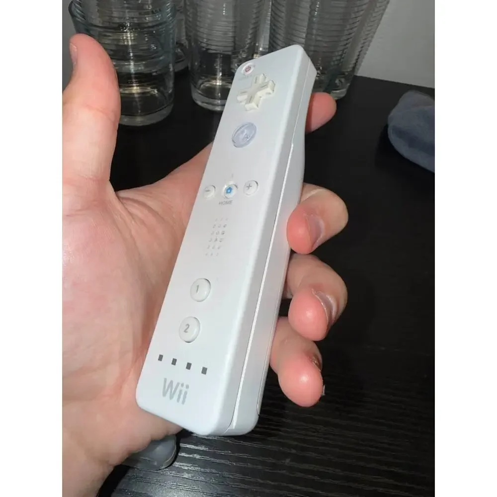 Nintendo Wii Remote with Nunchuk and Wii MotionPlus Adapter
